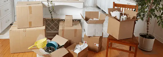 Packed moving boxes and household items in a kitchen before move-out or move-in cleaning, Stamford, CT.